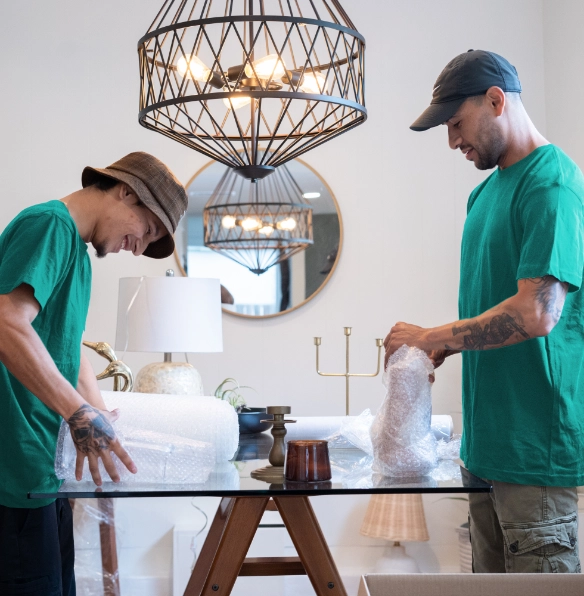 Movers packing household items