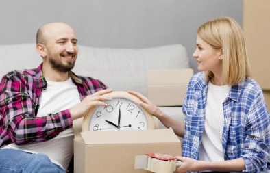 Two people holding household items